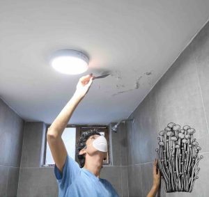 Person scraping bubbles off ceiling