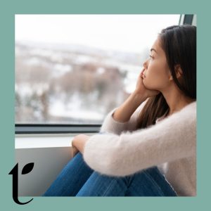 Woman staring out window