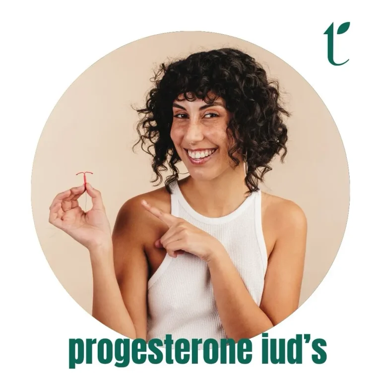 Woman holding IUD